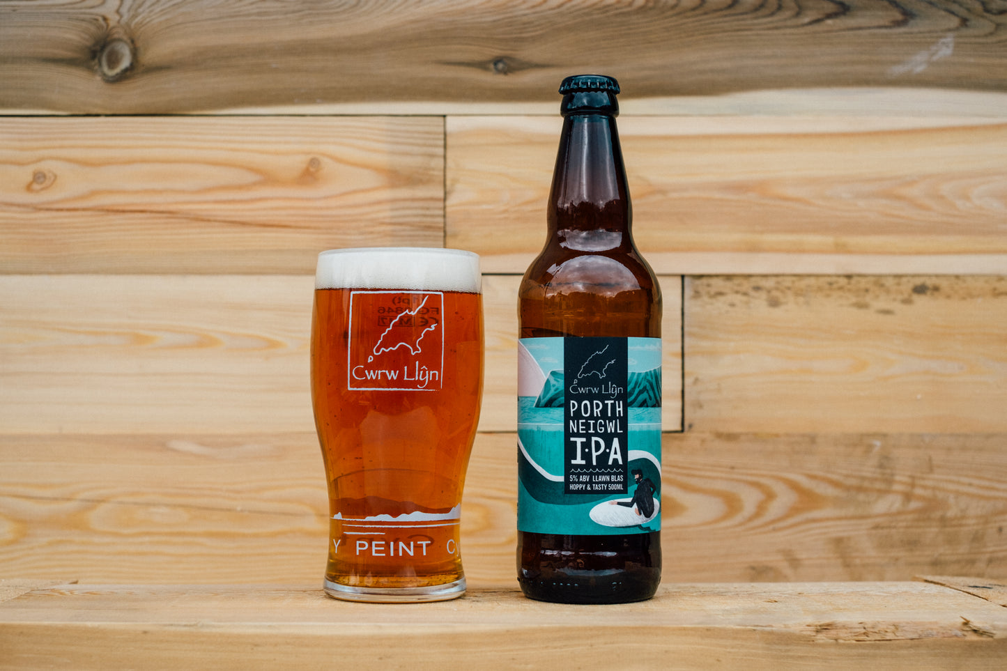 Porth Neigwl IPA beer bottle with a poured pint by Cwrw Llyn Brewery North Wales
