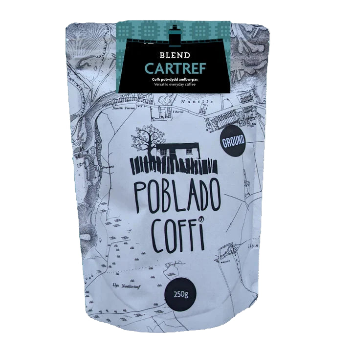 Coffee bag with map design and 'Poblado Coffi' branding on a white background Roasted in North Wales, this is their Cartref blend