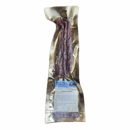 Packaged snack salami with a label on a white background