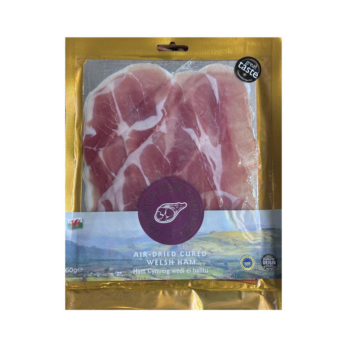 Packaged air-dried cured Welsh ham with gold and purple packaging on a white background
